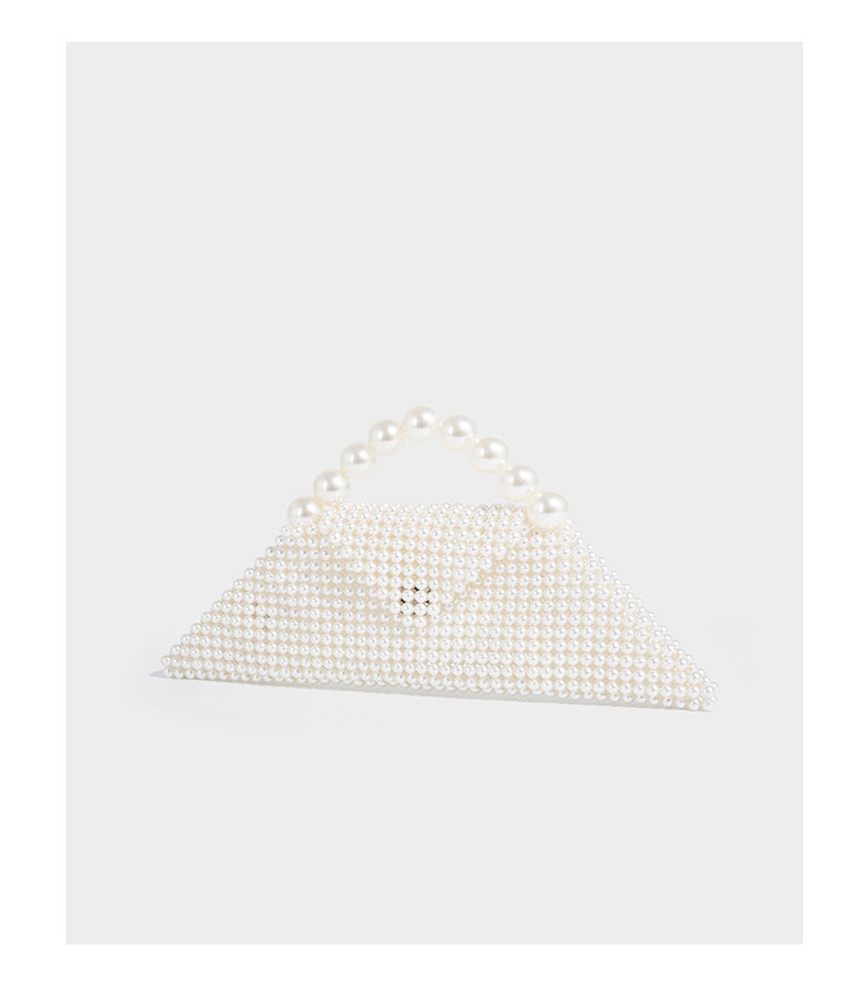 Small structured triangle clutch bag covered in glossy pearl beads with an arched pearl top handle and silver snap closure