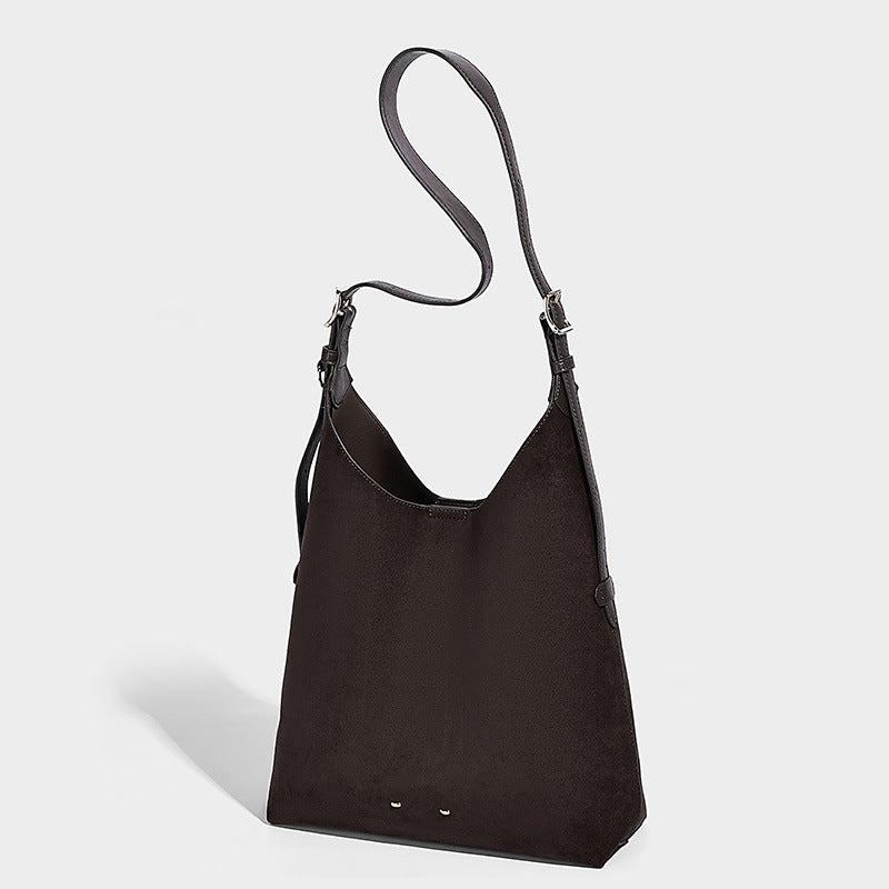 Large open-top hobo shoulder bag in tan leather-look finish with detachable zip pouch and adjustable buckle strap, detail