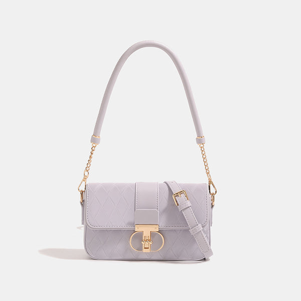 Compact quilted flap crossbody bag with gold turn-lock clasp and adjustable shoulder strap, detail view 8