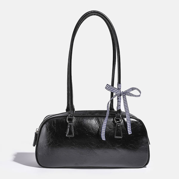 Rounded rectangular shoulder bag with glossy crinkled finish, dual long handles, top zip closure, and gingham ribbon bow
