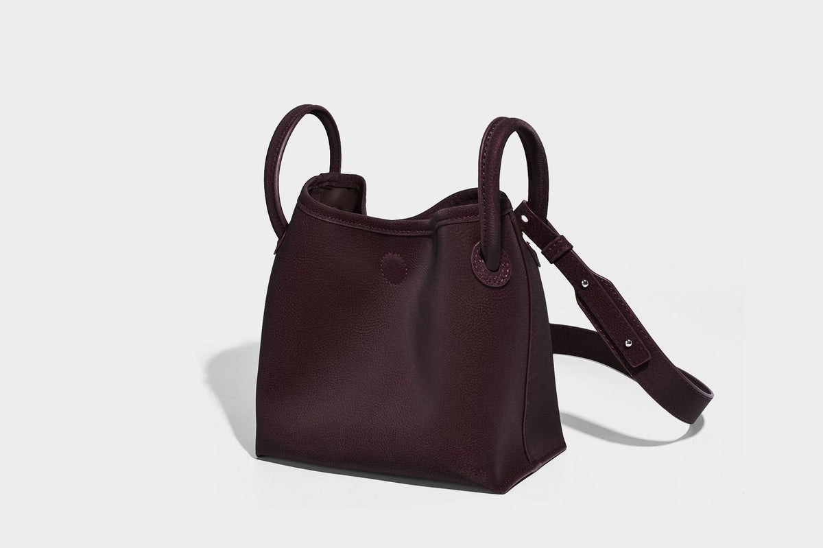 Small structured matte pebbled tote bag with twin top handles and removable zip pouch, detail view 28
