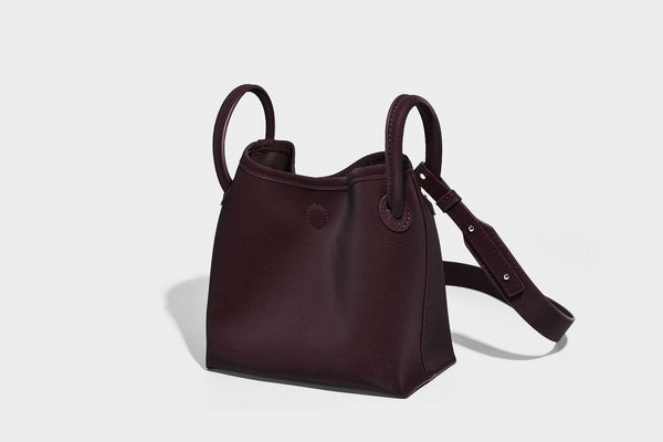 Small structured matte pebbled tote bag with twin top handles and removable zip pouch, detail view 28