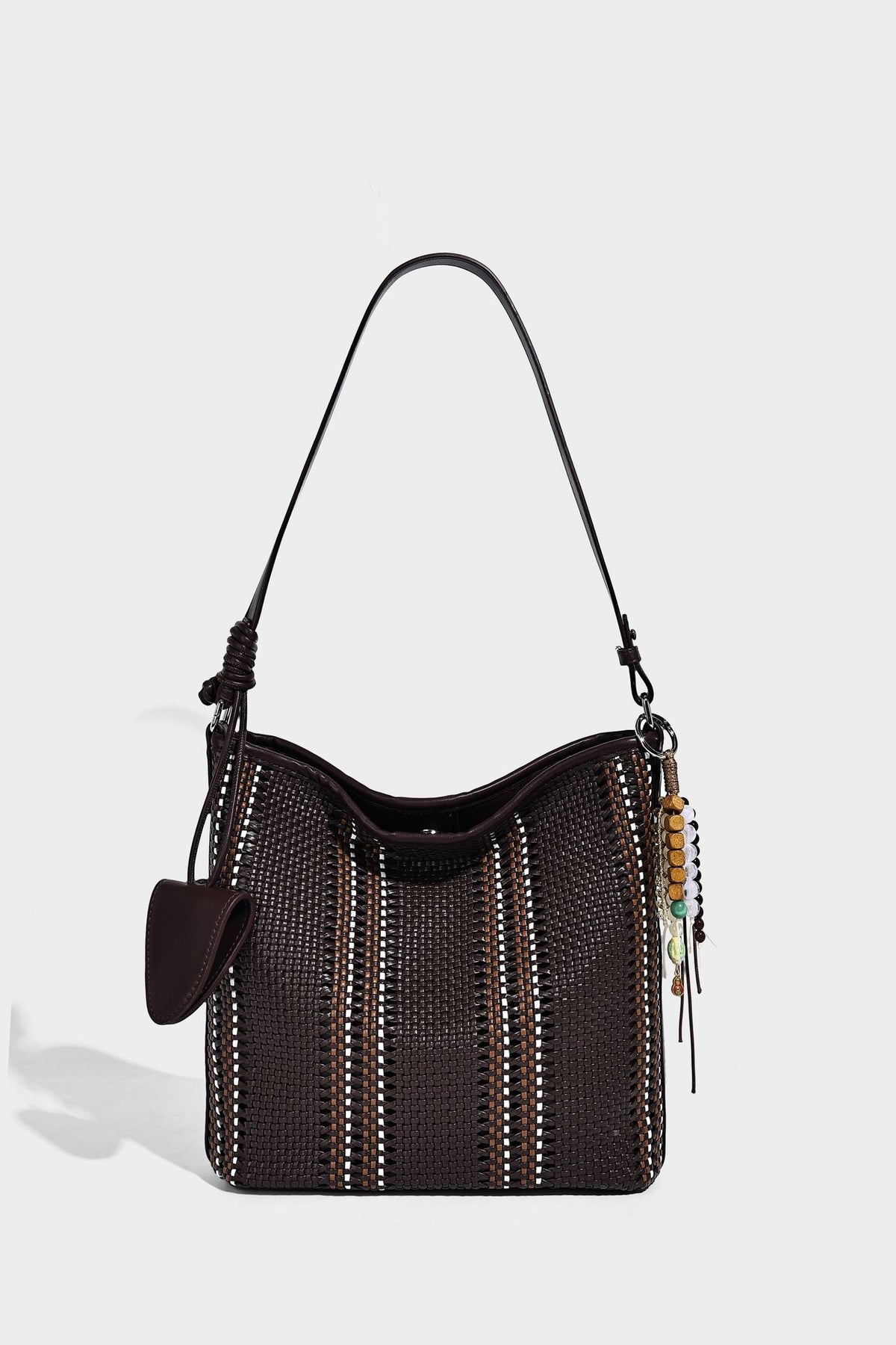 Woven bucket shoulder bag with leather-look trim, silver-tone hardware, and beaded tassel charm, detail view 18