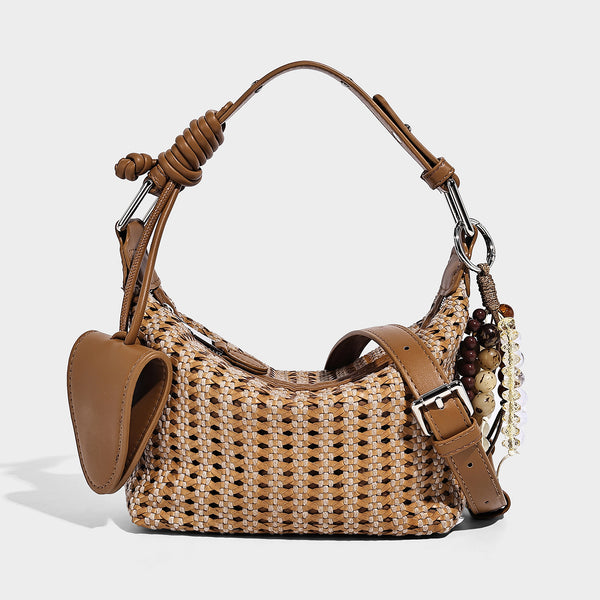 Woven crescent shoulder bag with leather-look knotted handle, zip top, attached mini pouch, and silver-tone hardware, detail