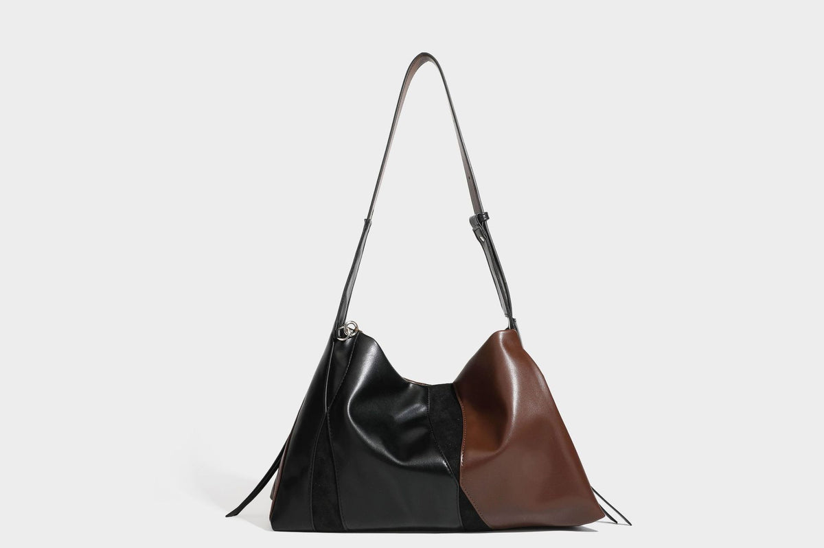 Two-tone black and brown leather-look slouchy shoulder bag with beaded tassel charm and silver-tone hardware, detail view 26