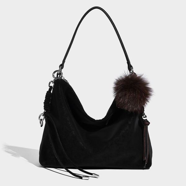 Slouchy matte-finish hobo shoulder bag with tassel cords, silver-tone hardware, and faux-fur pom charm, detail view 7