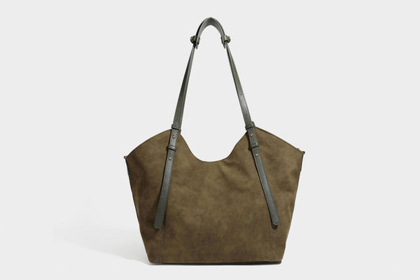 Oversized suede-finish tote shoulder bag in caramel brown with slim leather-look straps and gold-tone logo hardware, detail