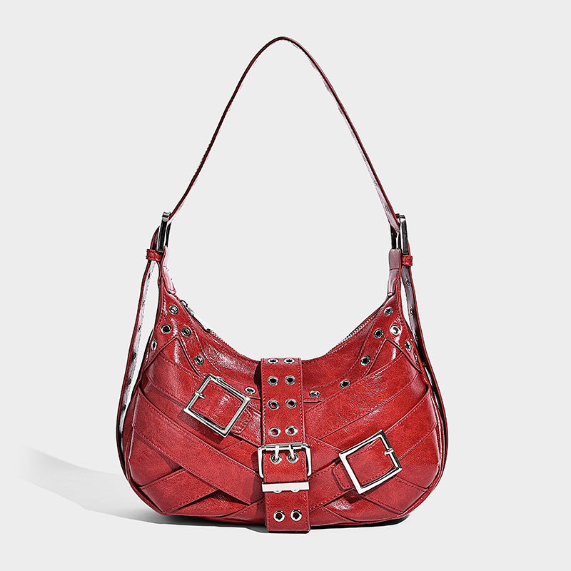 Glossy crescent hobo bag with silver-tone grommets, square buckle straps, and top zipper closure, detail view 4