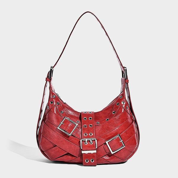 Glossy crescent hobo bag with silver-tone grommets, square buckle straps, and top zipper closure, detail view 4