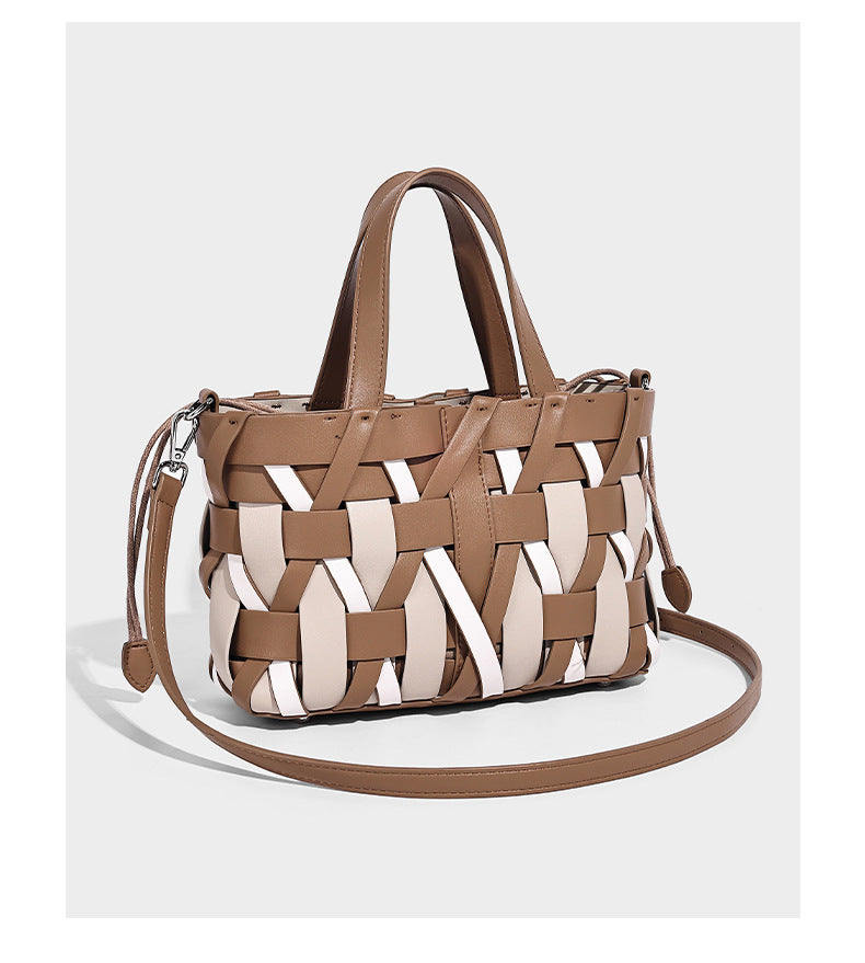 Small structured woven lattice tote bag with dual top handles and detachable shoulder strap in brown and cream leather-look