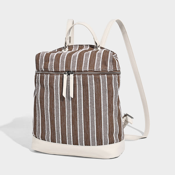 Small structured striped fabric backpack handbag with cream leather-look trim, top handle, and silver-tone hardware, front