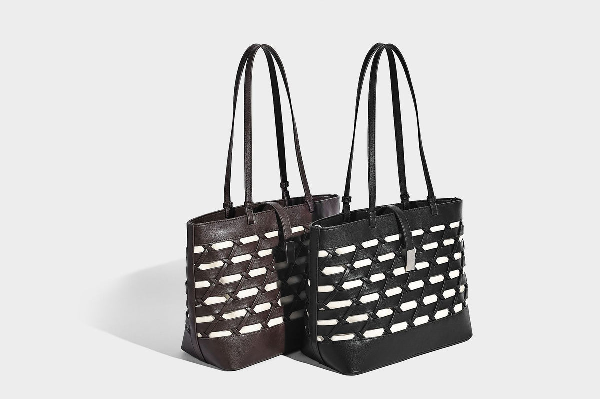 Structured woven lattice cutout tote bag with smooth leather-look trim, dual shoulder straps, and silver-tone hardware