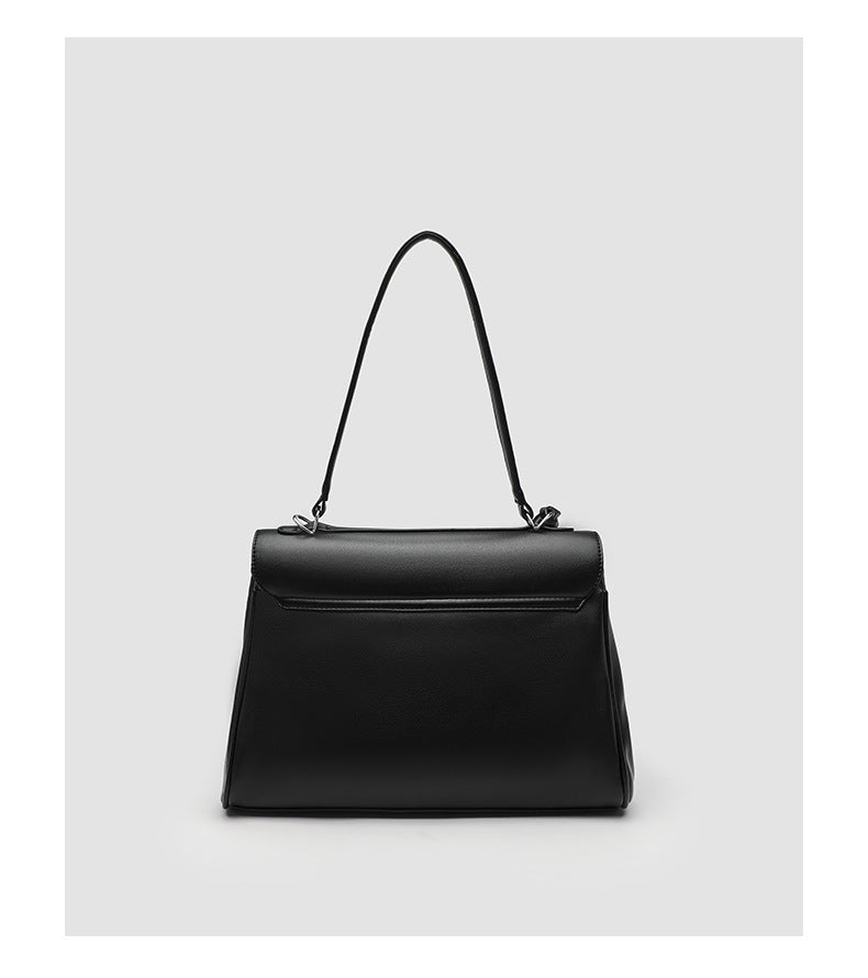 Structured black leather-look flap satchel bag with silver turn-lock hardware and top handle, detail view 17
