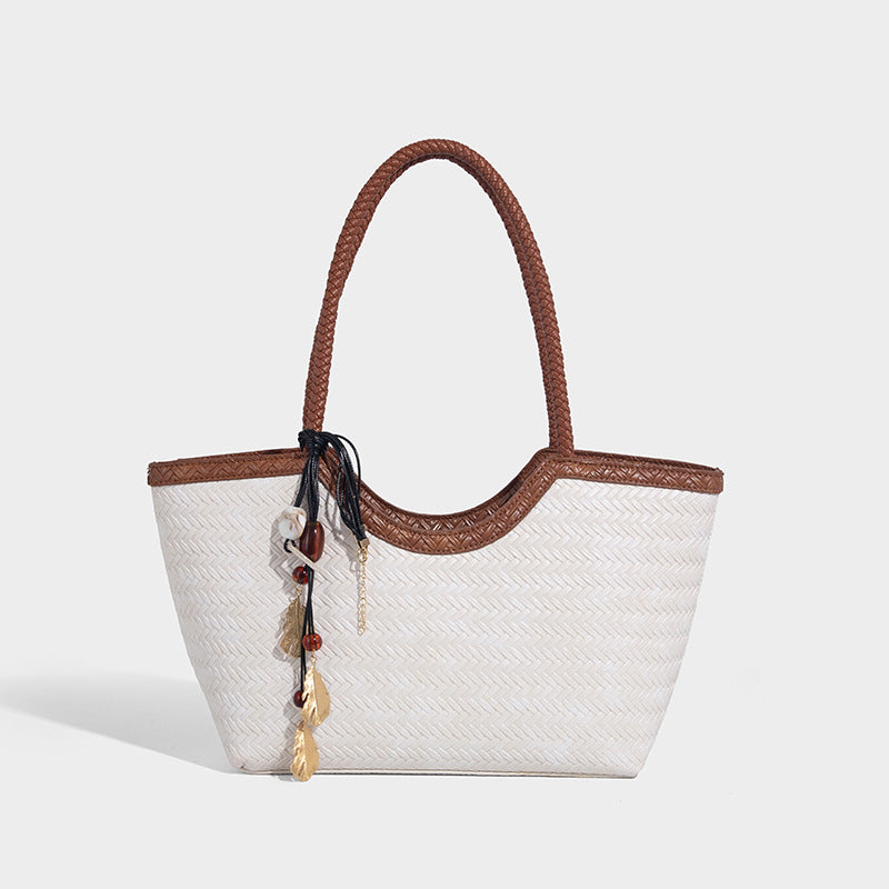 Large open-top woven tote bag with contrasting braided double handles and matching drawstring pouch, detail view 12