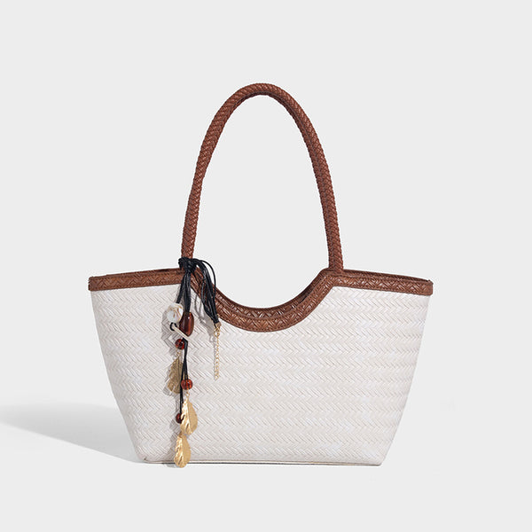 Large open-top woven tote bag with contrasting braided double handles and matching drawstring pouch, detail view 12