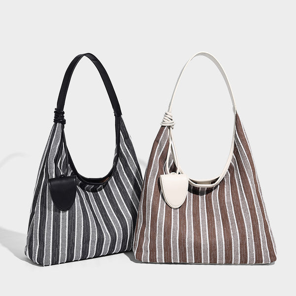 Slouchy striped canvas hobo shoulder bag with cream trim and long knotted strap, detail view 2