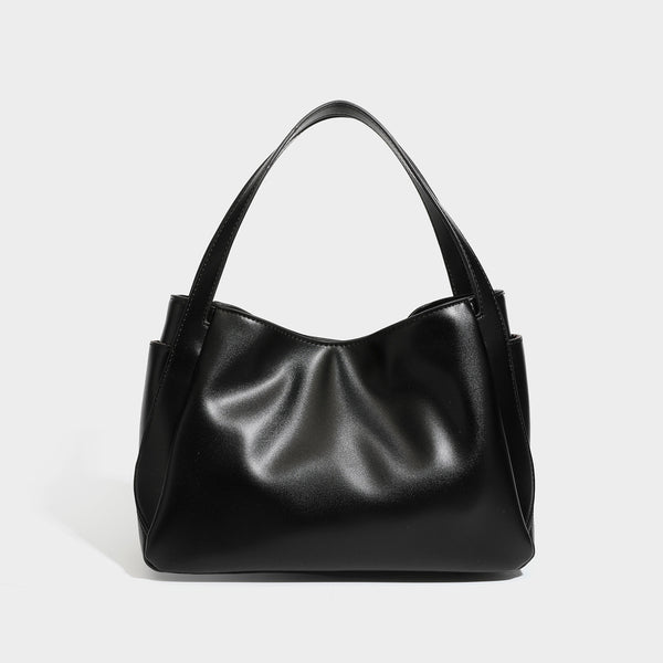 Structured glossy leather-look tote shoulder bag with dual top handles, detachable crossbody strap, side pockets, and, detail