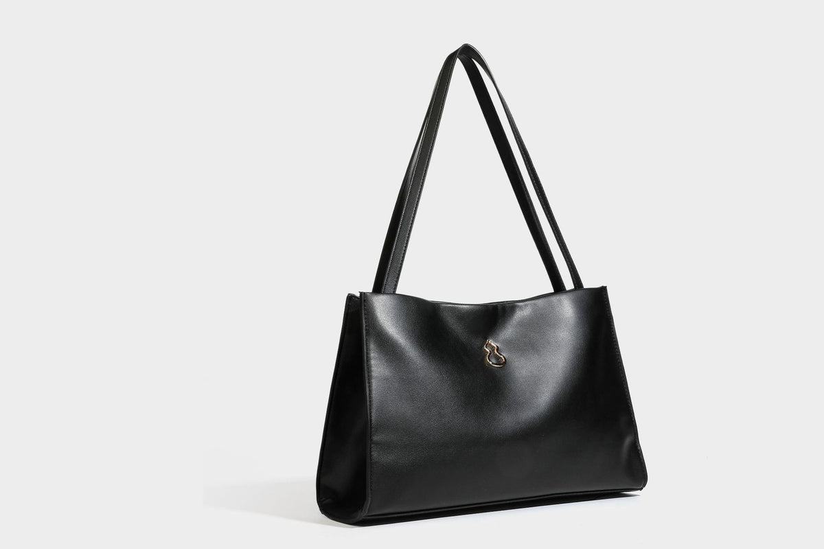 Structured rectangular shoulder tote bag with smooth leather-look finish, long double straps, and gold-tone gourd emblem on