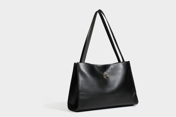 Structured rectangular shoulder tote bag with smooth leather-look finish, long double straps, and gold-tone gourd emblem on