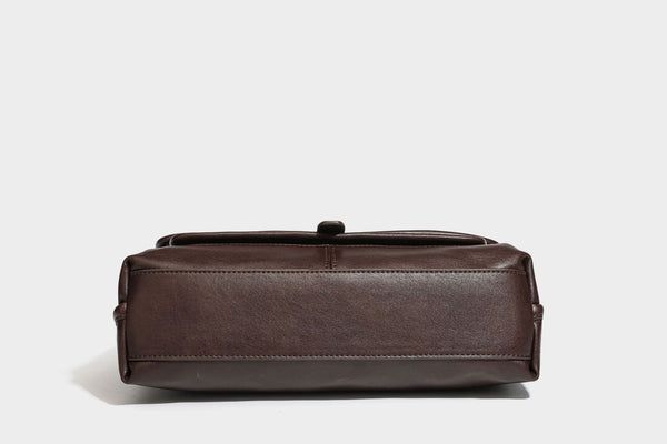 Structured rectangular satchel bag in dark espresso brown with smooth leather-look finish, flap front with silver turn-lock