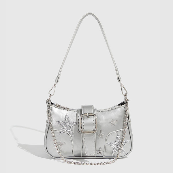 Compact metallic silver shoulder bag with glitter star appliqués, rhinestone star charms, front belt buckle strap, chunky
