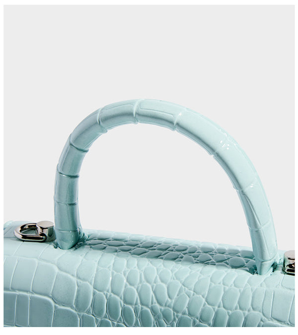 Mini croc-embossed glossy structured handbag with silver-tone turn-lock clasp and short top handle, detail view 16