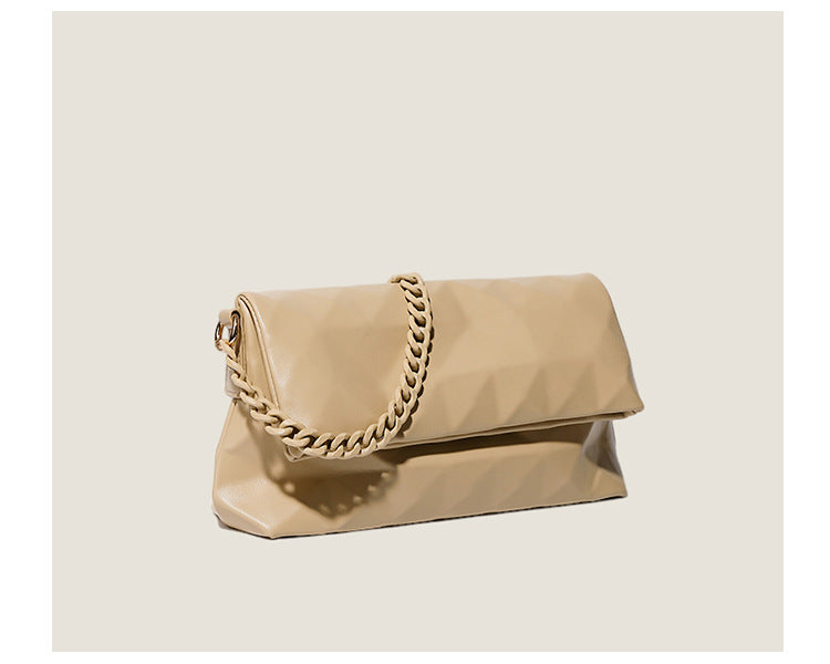 Cream white rectangular flap shoulder bag with geometric faceted surface and chunky tone-on-tone chain strap with gold-tone