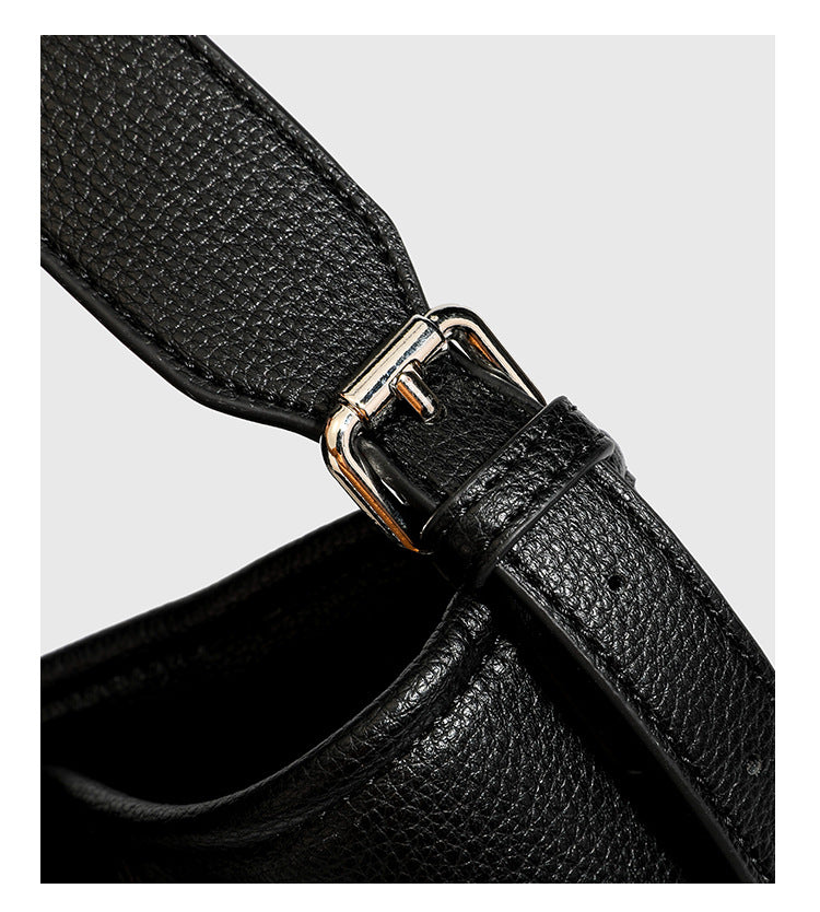Large black pebbled leather-look hobo shoulder bag with silver-tone turn-lock front hardware and single flat adjustable
