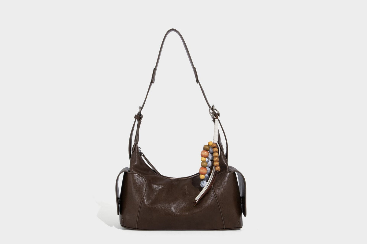 Soft pebbled leather-look hobo shoulder bag with zip top closure, side flap pockets, and silver-tone hardware, detail view 32