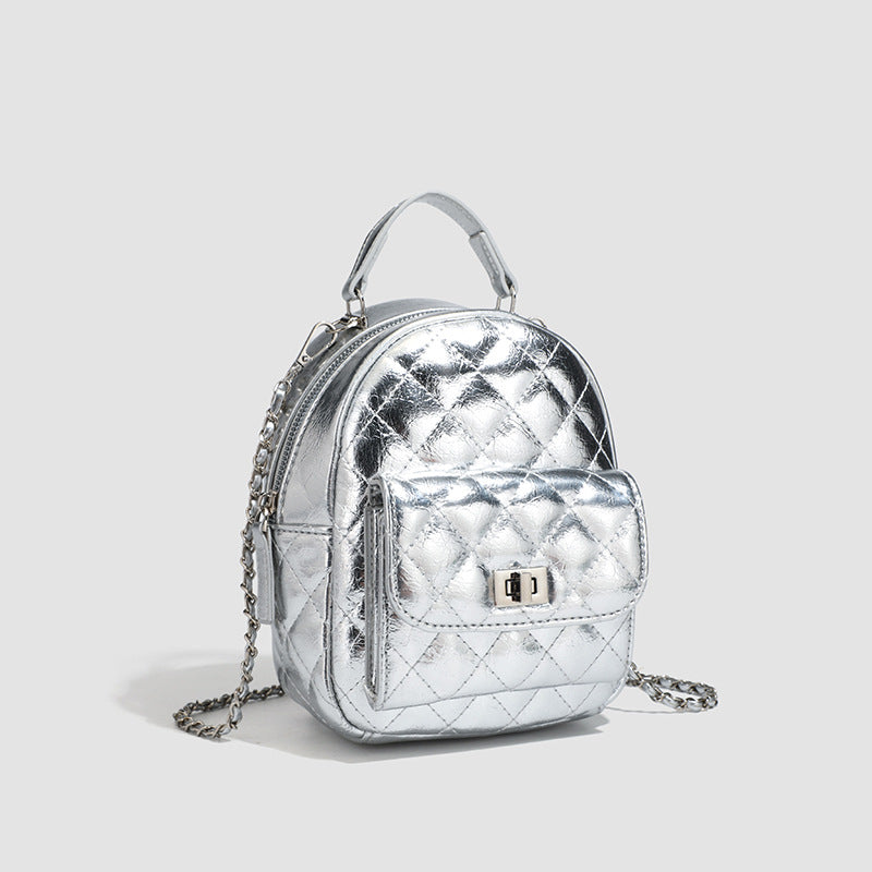 Quilted leather-look backpack purse with chain strap and turn-lock front pocket, detail view 3