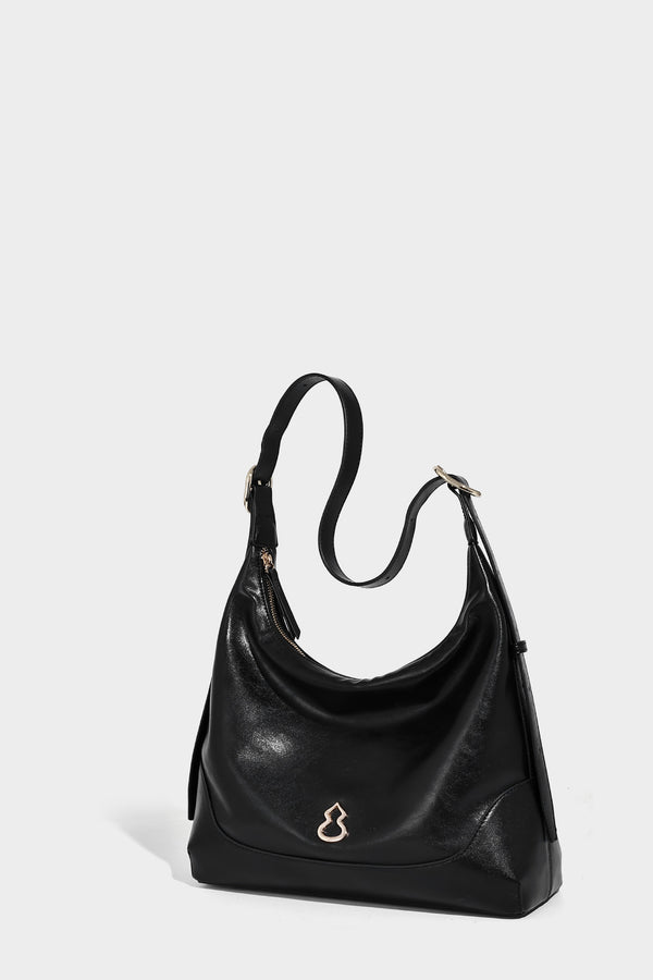 Glossy leather-look slouchy hobo shoulder bag with zip closure, gold-tone hardware, and adjustable strap, detail view 26