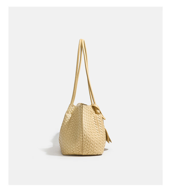 Woven leather-look tote bag in yellow with long shoulder straps, heart-shaped hanging charm, and removable inner zip pouch