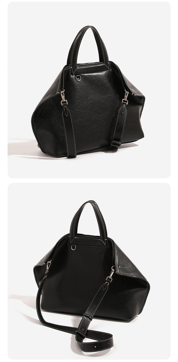 Structured cognac brown leather-look tote bag with fold-ear side panels, top handles, gold-tone hardware, and detachable