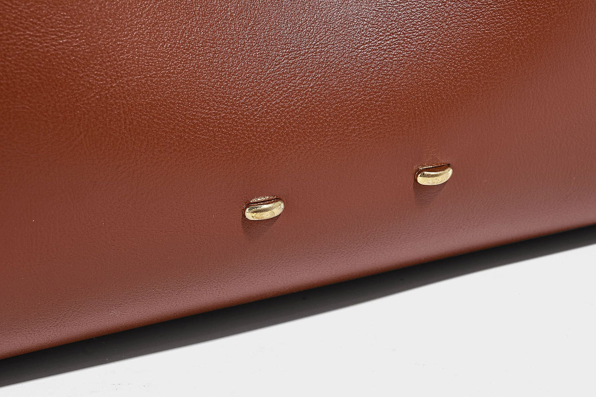 Large open-top hobo shoulder bag in tan leather-look finish with detachable zip pouch and adjustable buckle strap, detail