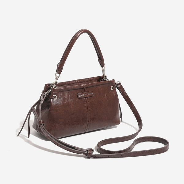 Compact retro mini shoulder bag with crinkled leather-look finish, drawstring side detail, and silver-tone hardware, detail
