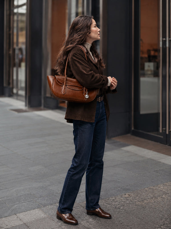 Structured leather-look flap shoulder bag with contrast stitching and silver ball charm hardware, detail view 9