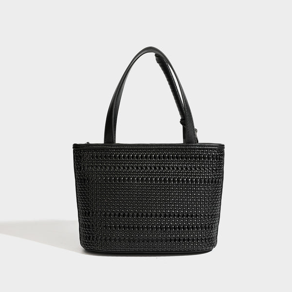 Structured open-weave tote bag with smooth leather-look trim, double top handles, detachable crossbody strap, and mini zip