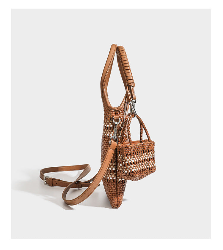 Color-block woven tote bag with rounded leather-look handles, detachable crossbody strap, and matching mini clip-on pouch in