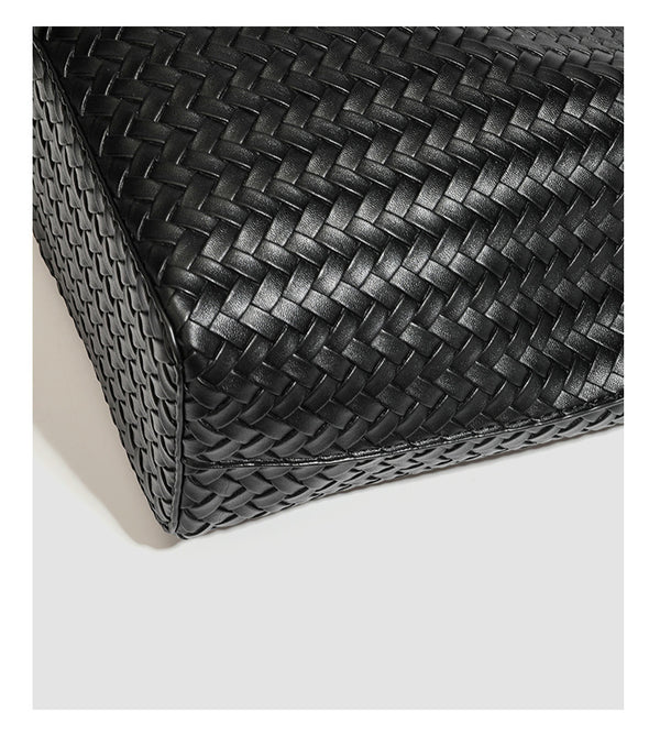 Large black basket-weave leather-look tote bag with long braided shoulder straps and matching woven zip pouch, detail view 23