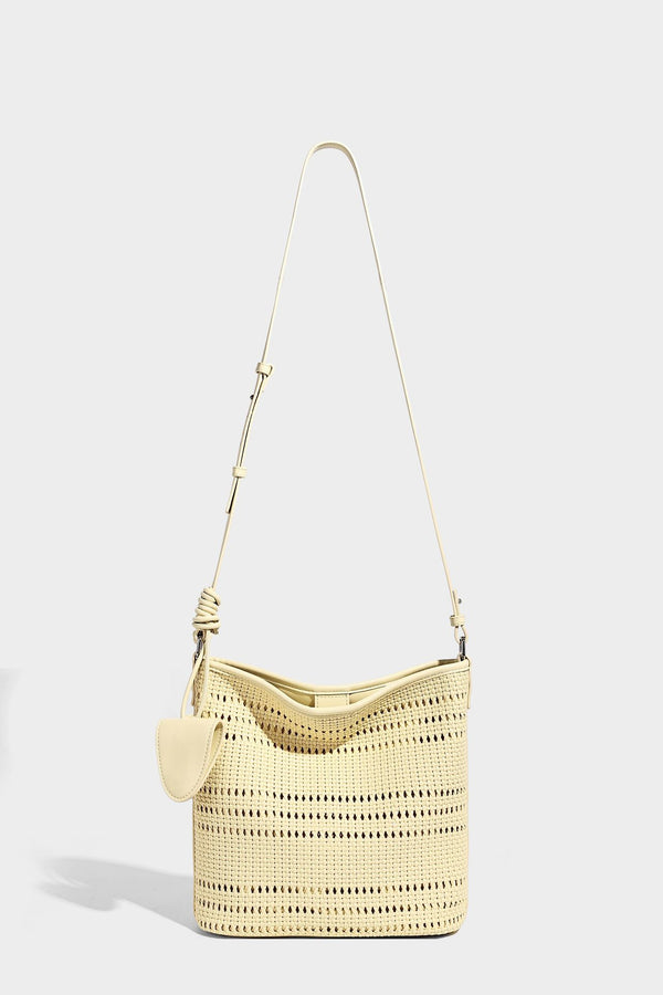 Handwoven open-weave shoulder bag with leather-look trim, knotted adjustable strap, and clip-on sunglasses sleeve pouch
