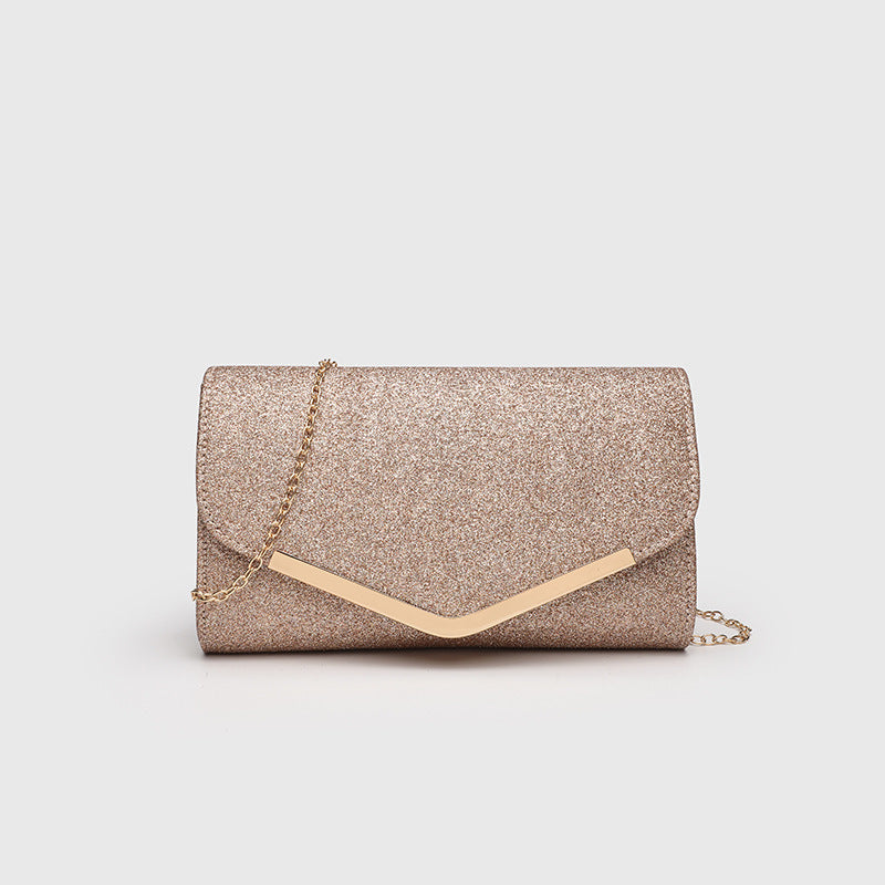 Structured glitter envelope clutch bag with gold-tone V-bar hardware and detachable chain strap, detail view 8