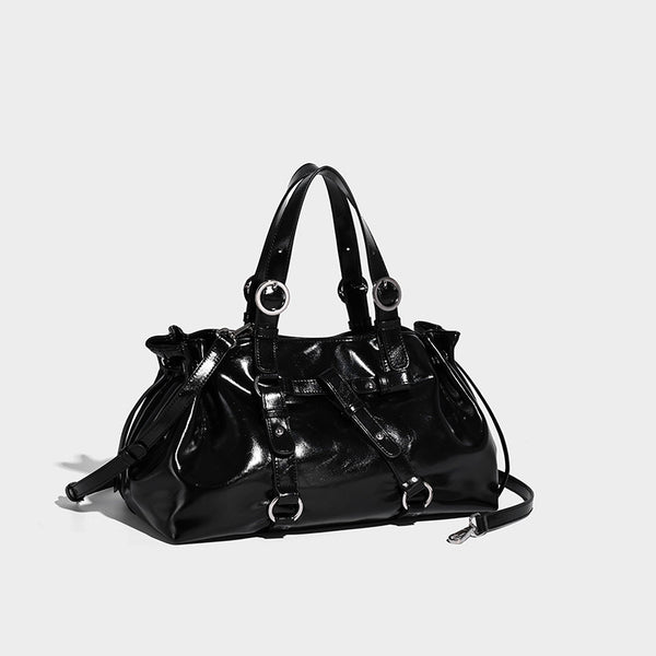 Glossy patent-look slouchy tote bag with ruched drawstring sides, dual top handles, silver ring hardware, and detachable