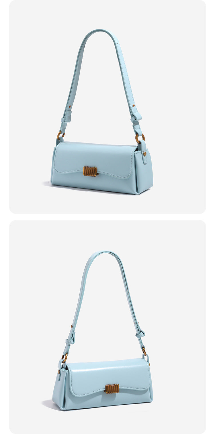 Structured rectangular baguette shoulder bag in pastel sky blue with smooth leather-look finish, ribbed gold-tone turn-lock