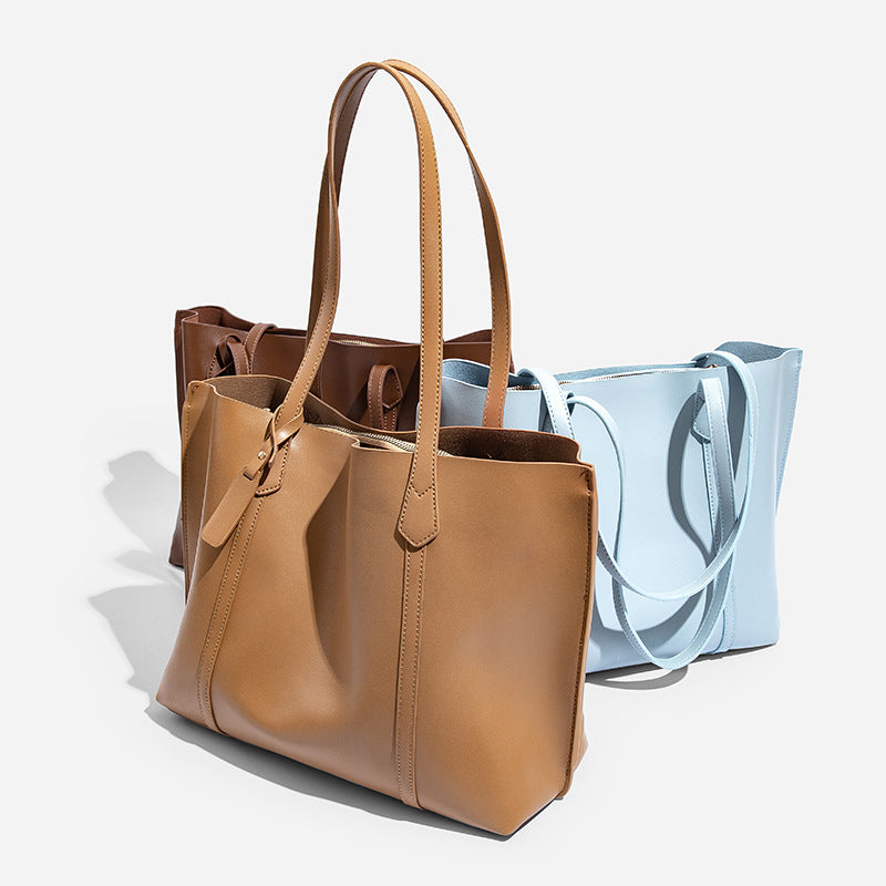 Large structured leather-look tote bag with belt-strap detail and gold-tone hardware, detail view 3