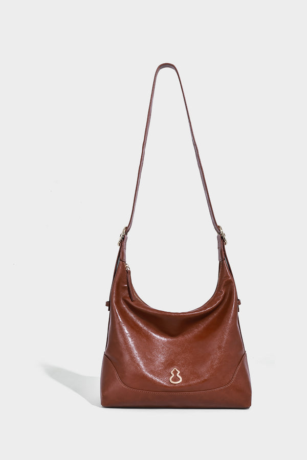 Glossy leather-look slouchy hobo shoulder bag with zip closure, gold-tone hardware, and adjustable strap, detail view 14