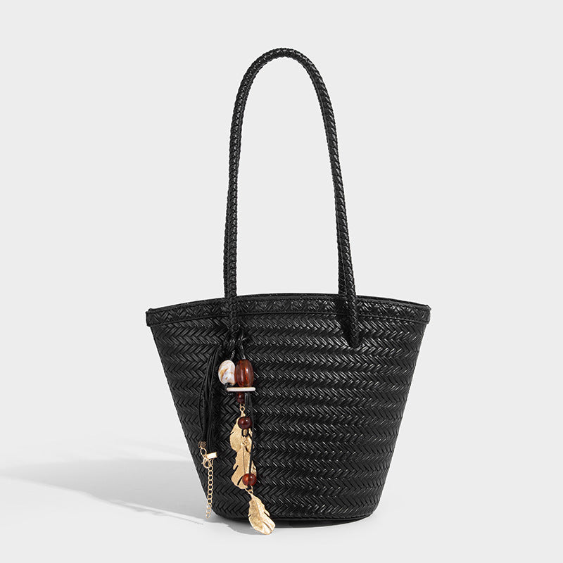 Chevron-woven bucket tote bag with braided shoulder straps and matching drawstring pouch, detail view 3
