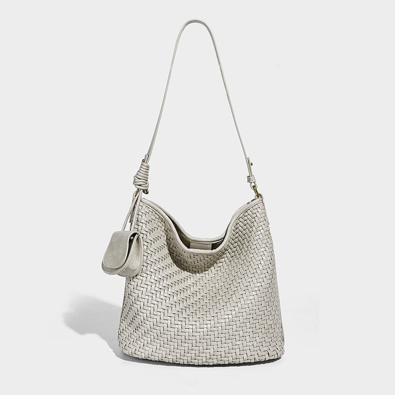 Woven leather-look bucket bag with basket-weave texture, attached mini pouch, and adjustable shoulder strap, detail view 6