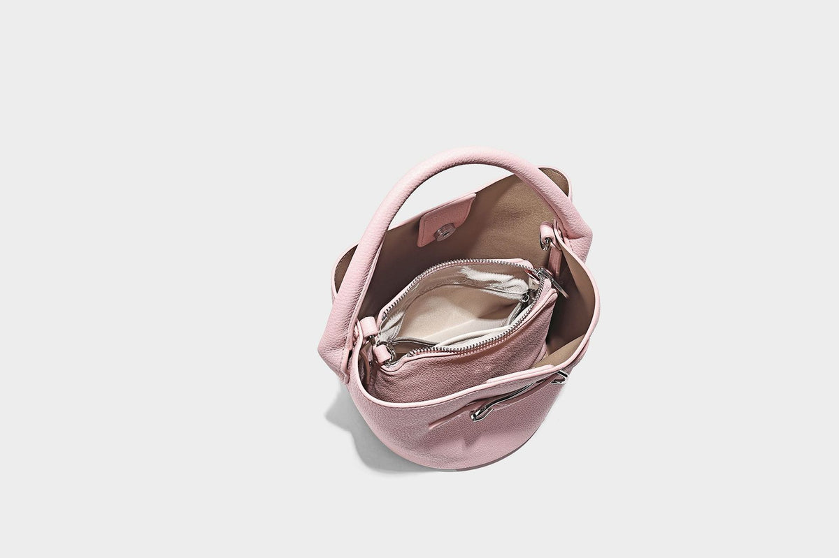Mini pebbled leather-look bucket bag with front buckle strap, silver-tone hardware, top handle, and detachable shoulder
