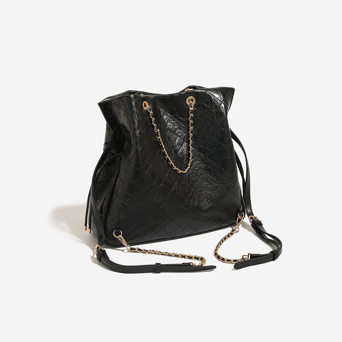 Large quilted leather-look drawstring backpack handbag with gold-tone chain handles and front flap pocket, detail view 3