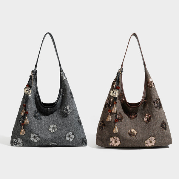 Lässige Trapez-Schulter-Tote in Anthrazit mit floralen Motiven aus silberfarbenen Pailletten, Trageriemen in Lederoptik und herabhängendem, perlenverziertem